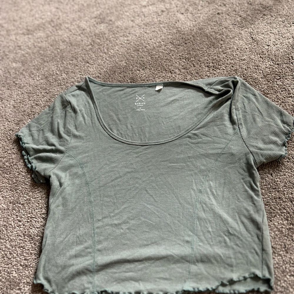 Blue lettuce cut crop top, blue stitching detail.